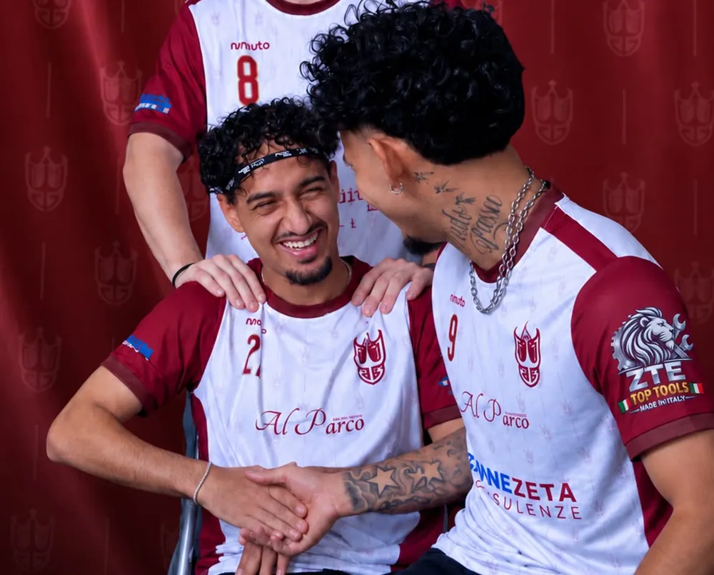 Three Far3 FC players in white and burgundy football jerseys with a tone-on-tone crest pattern, numbers, chest sponsors and a sleeve sponsor patch